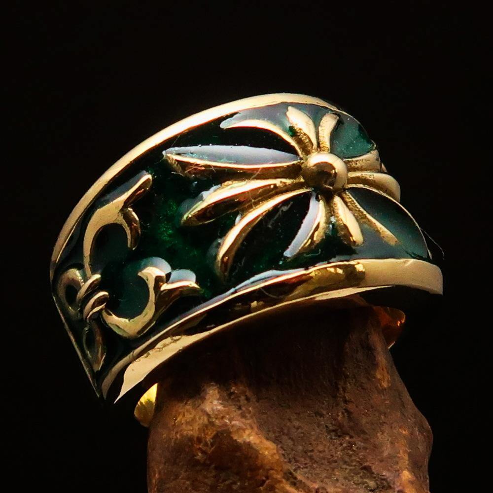Men's Fleur de Lis Band Ring in solid brass with green enamel finish, showcasing its elegant design and polished surface.