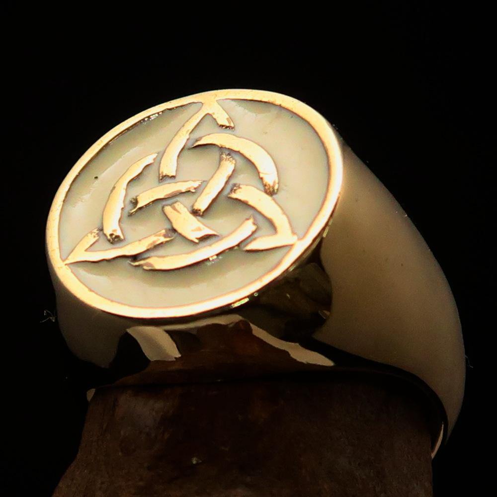 Men's Triquetra Ring featuring a Celtic Triskelion Knot design in high-polished brass with white enamel finish.