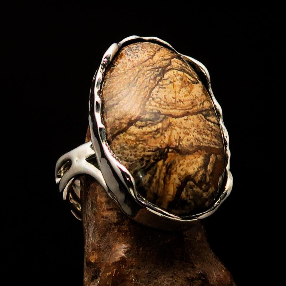 Oval shaped sterling silver ring featuring a brown Picture Jasper stone, hallmarked 925, with elegant symmetric design.