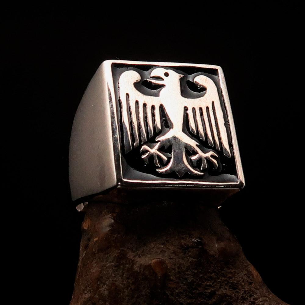 Men's black German Eagle Seal Ring made of sterling silver with black enamel accents, showcasing a polished finish and intricate design.