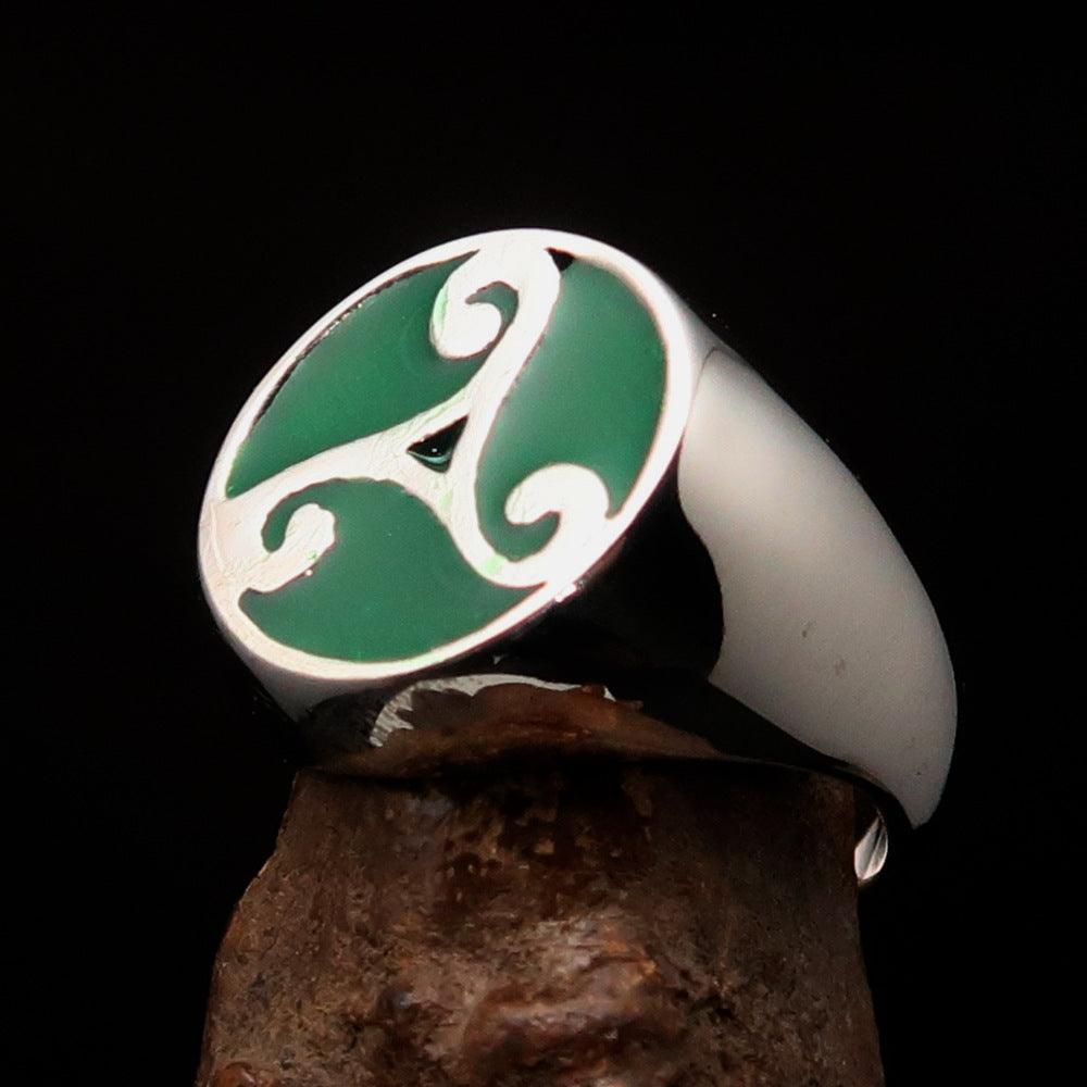 Men's Celtic Triade Ring in sterling silver with green enamel Triskele design, showcasing intricate craftsmanship and high polish finish.