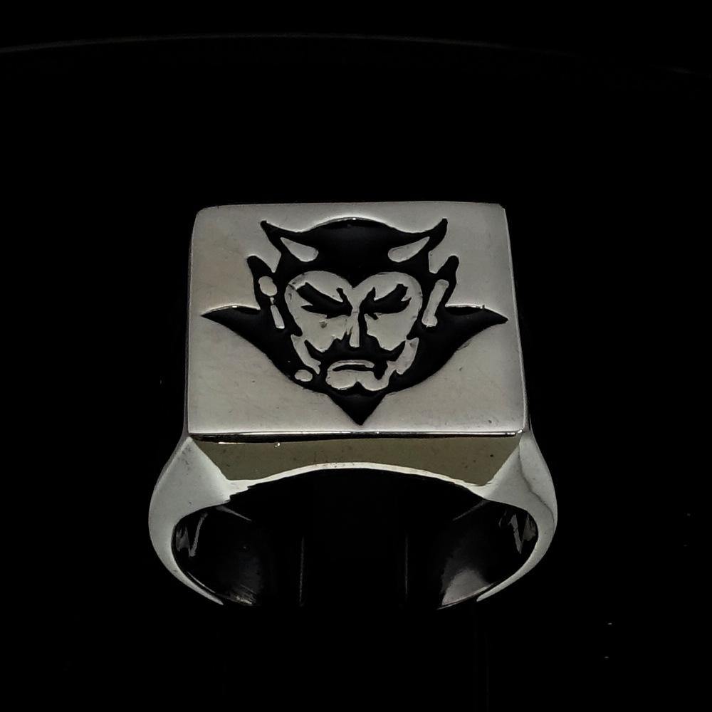 Men's Devil Ring crafted from solid sterling silver with black enamel finish, showcasing a high-polished surface and unique design.