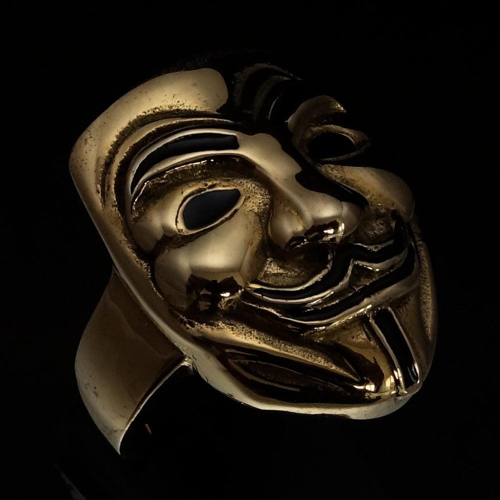 Men's Harlequin Ring featuring an antiqued brass design inspired by Venice Carnival masks, showcasing intricate details and polished accents.