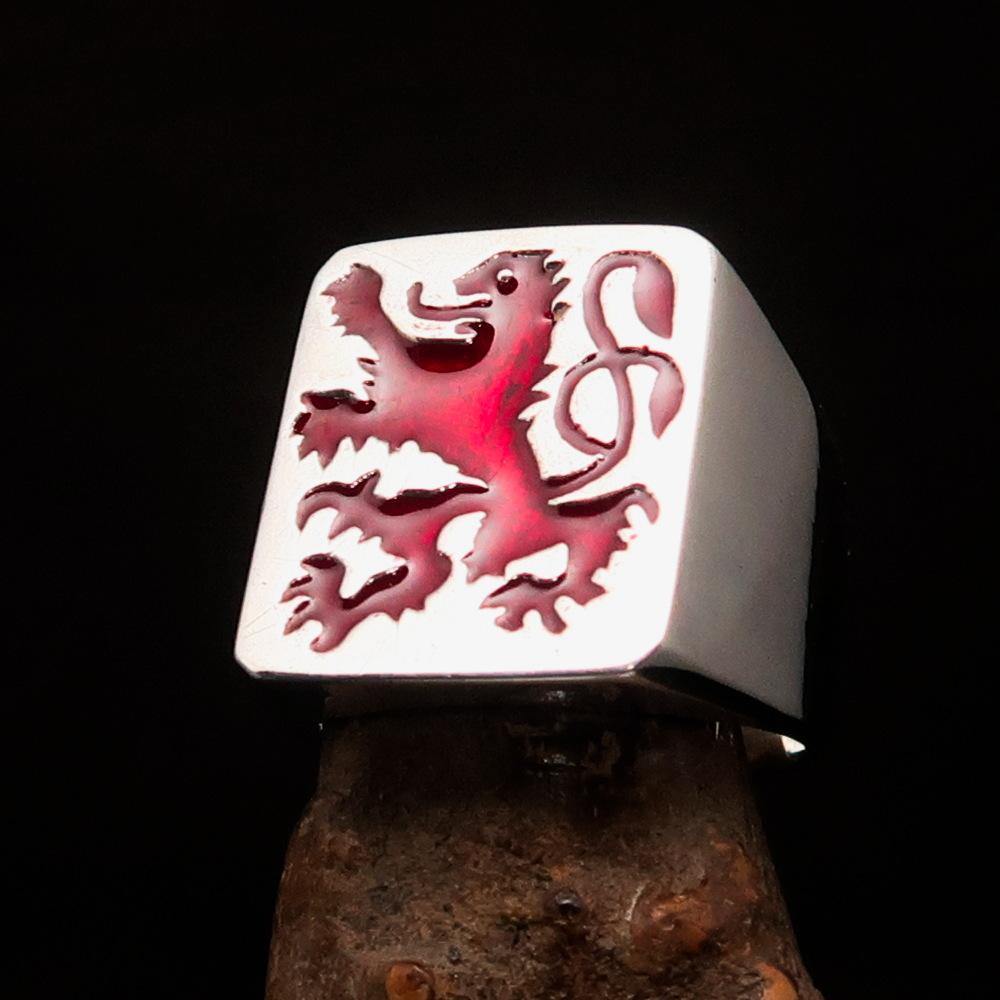 Men's red Rampant Lion ring made of sterling silver with vibrant red enamel accents, showcasing a bold design.