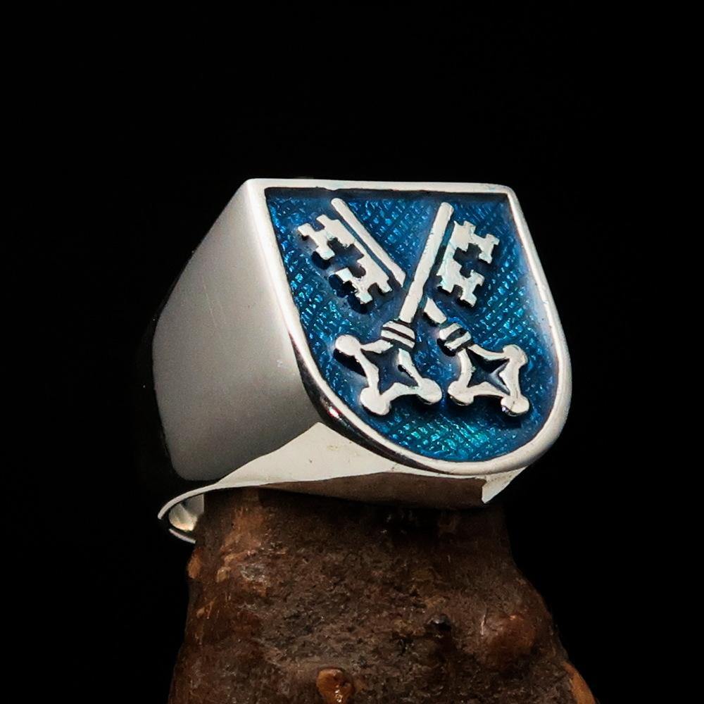 Men's Shield Ring with crossed blue skeleton keys, crafted from solid sterling silver with a high polish finish and blue enamel.
