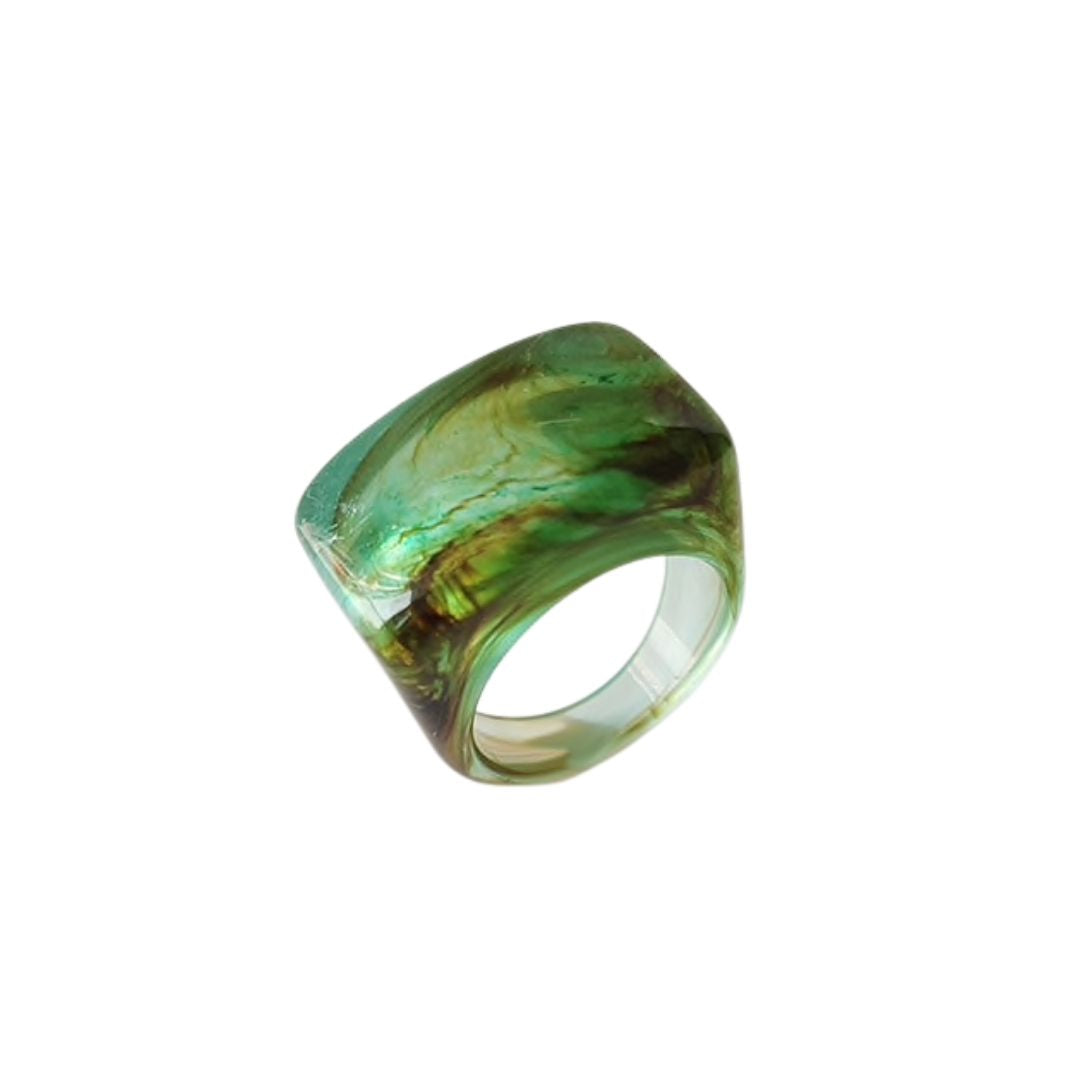A colorful Resin Swirl Statement Ring showcasing unique swirl patterns in vibrant colors, perfect for fashion-forward individuals.