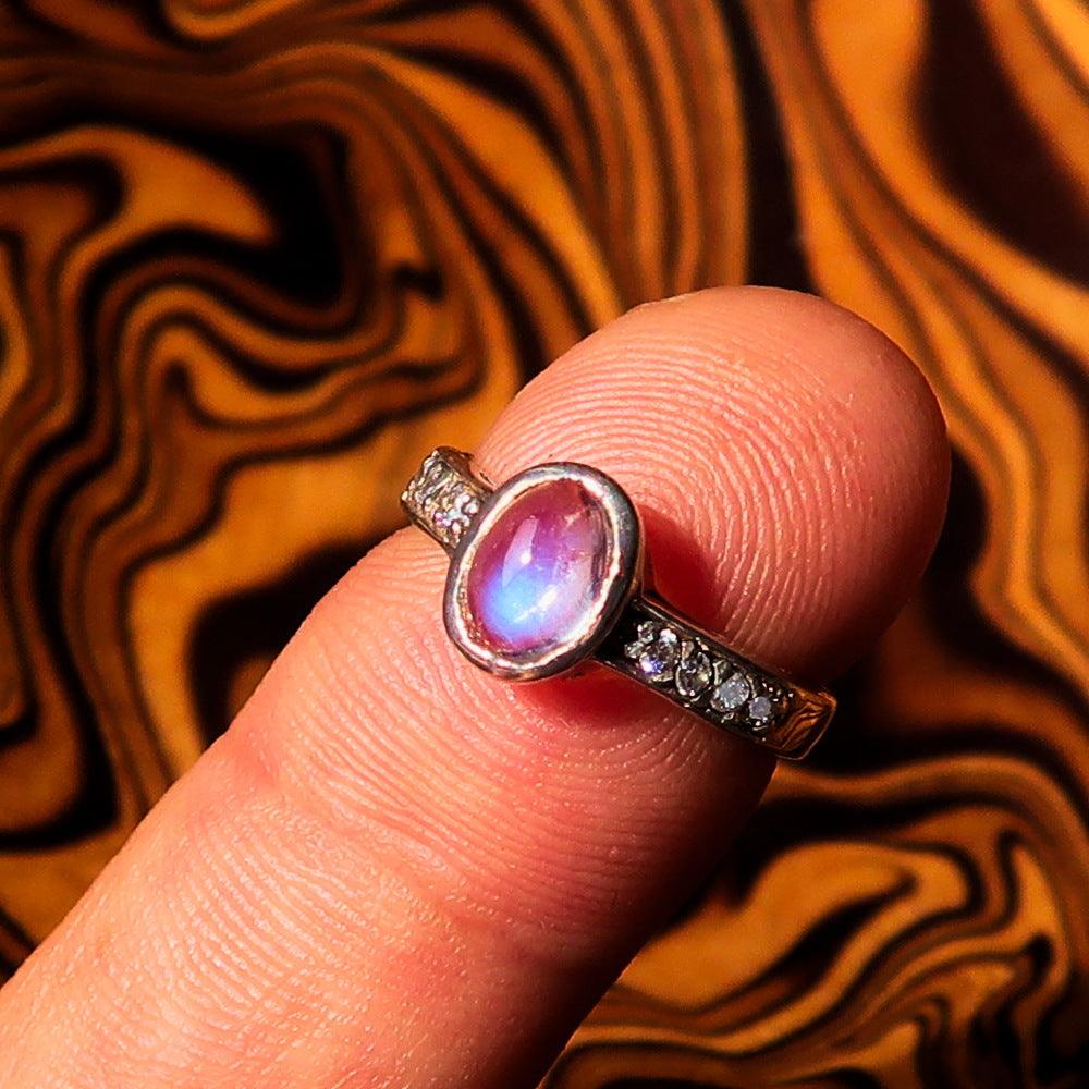 Sterling Silver Solitaire Ring featuring an oval Ceylon Moonstone, hallmarked 925, showcasing its elegant design and polished finish.