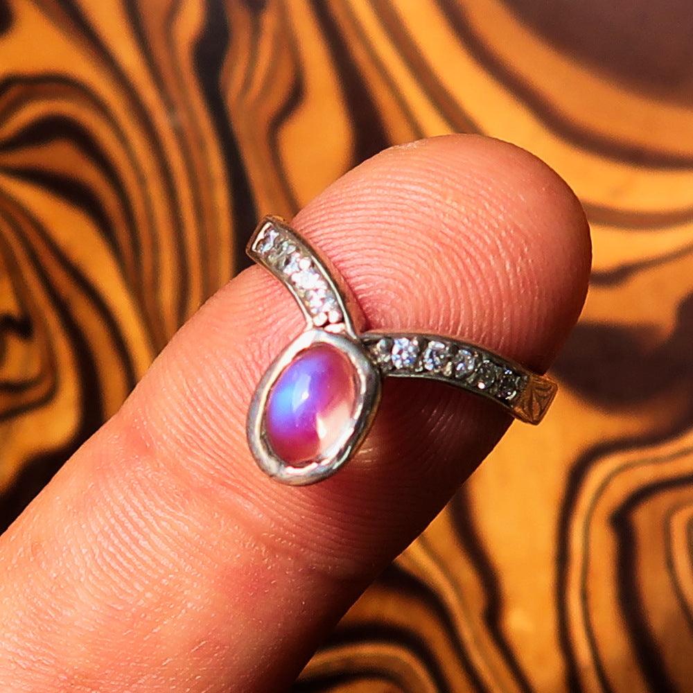 Sterling Silver Solitaire Ring featuring an oval cut Ceylon Moonstone, hallmarked 925, showcasing its elegant design.