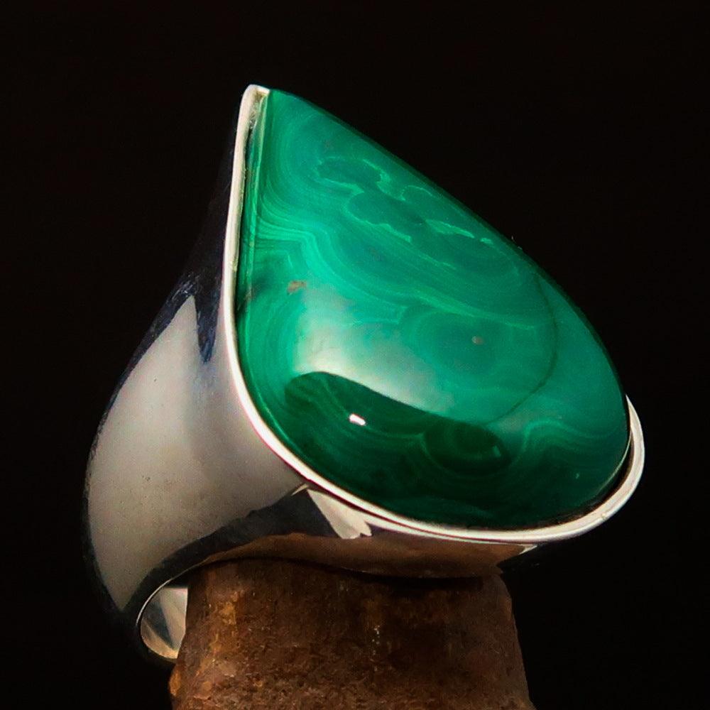 Tear shaped mirror polished sterling silver ring featuring a pear-shaped green malachite stone, showcasing its elegant design.