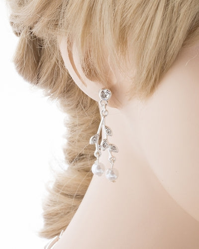 Bridal Wedding Jewelry Set featuring a Crystal Rhinestone Floral Pearl Necklace and matching earrings, elegantly displayed on a soft fabric background.