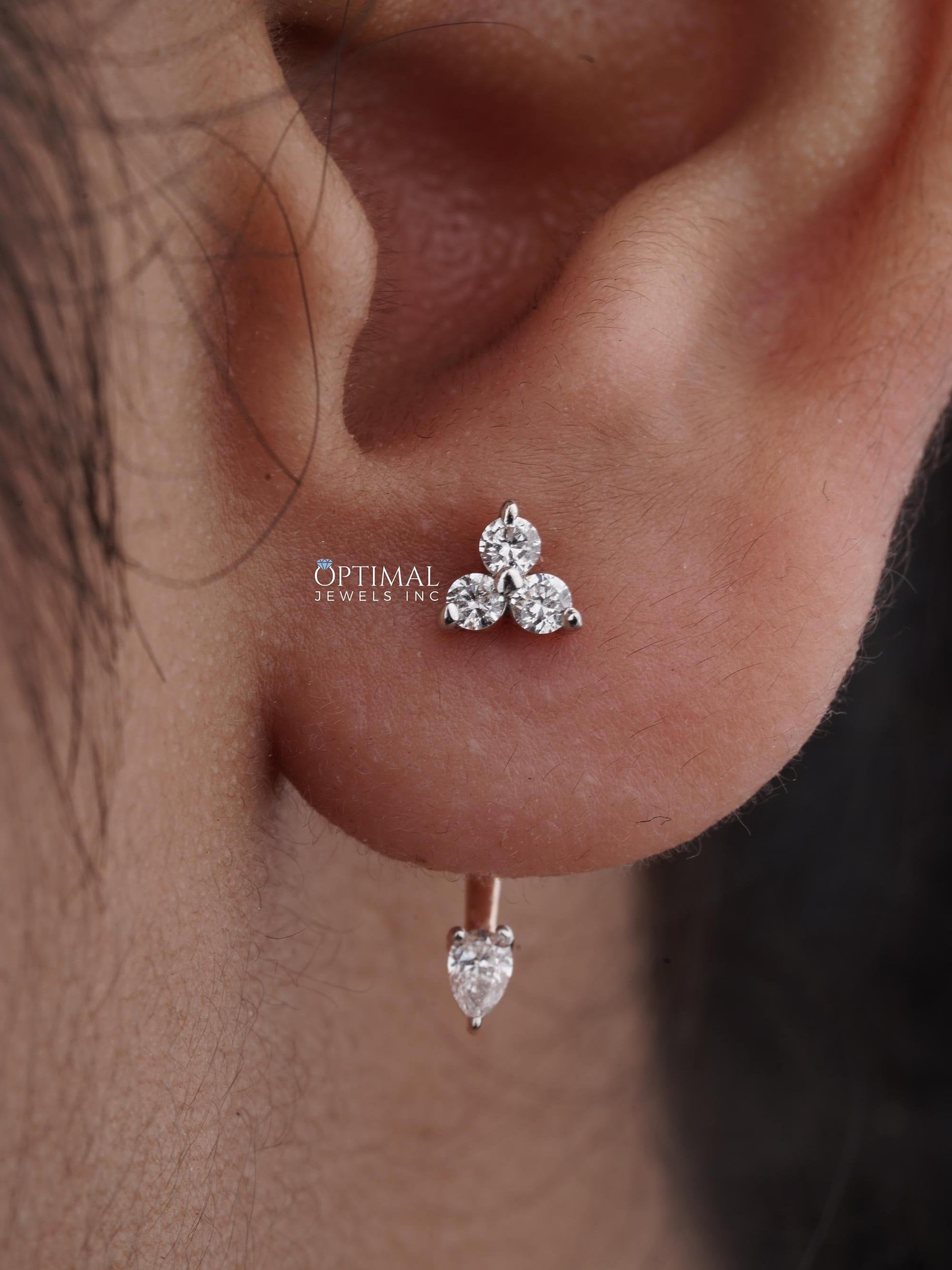 0.50 CTW Unique Rose Gold Earring featuring lab-grown diamonds in asymmetric design with round and pear-cut stones.