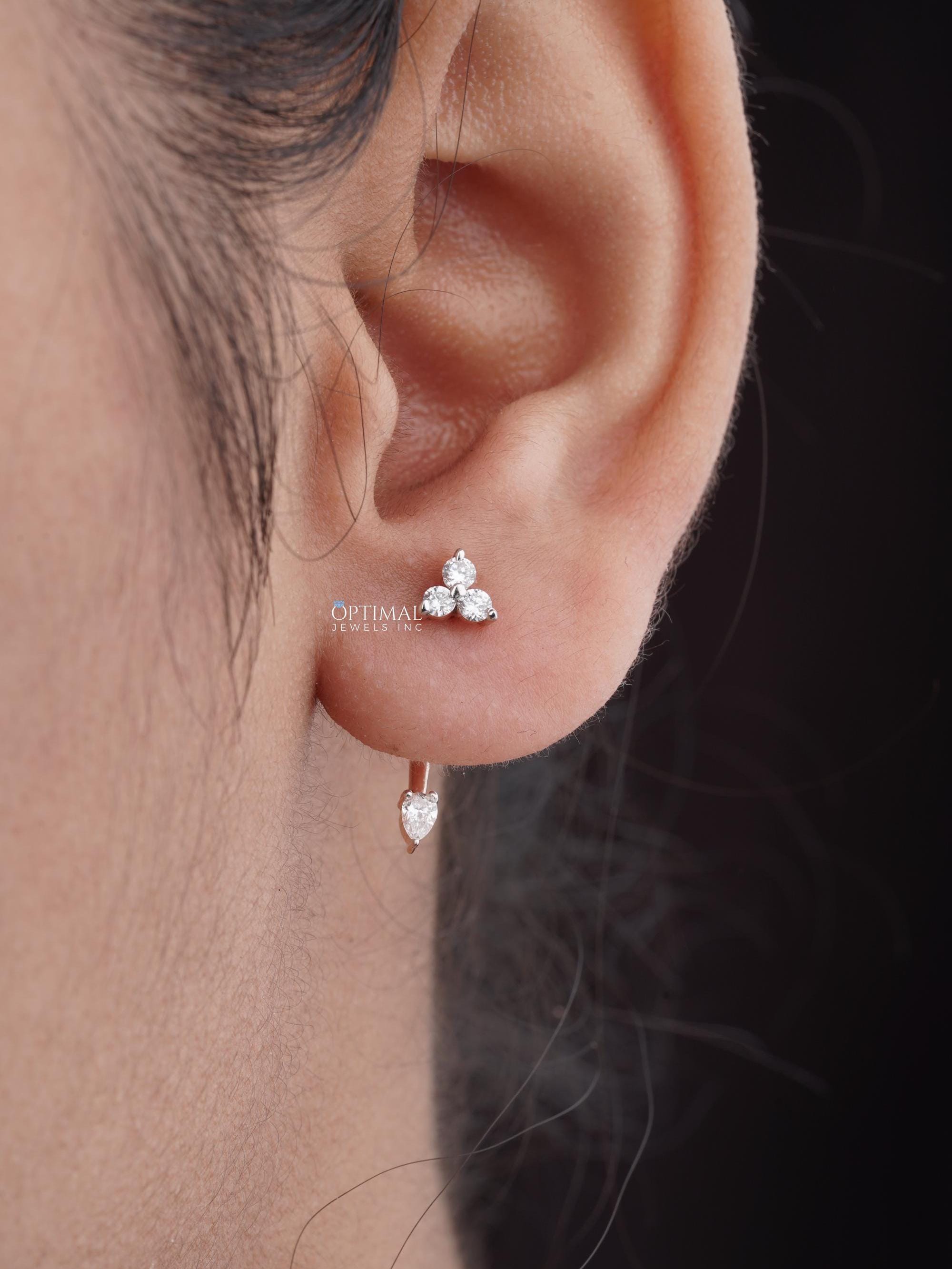 0.50 CTW Unique Rose Gold Earring featuring lab-grown diamonds in asymmetric design with round and pear-cut stones.