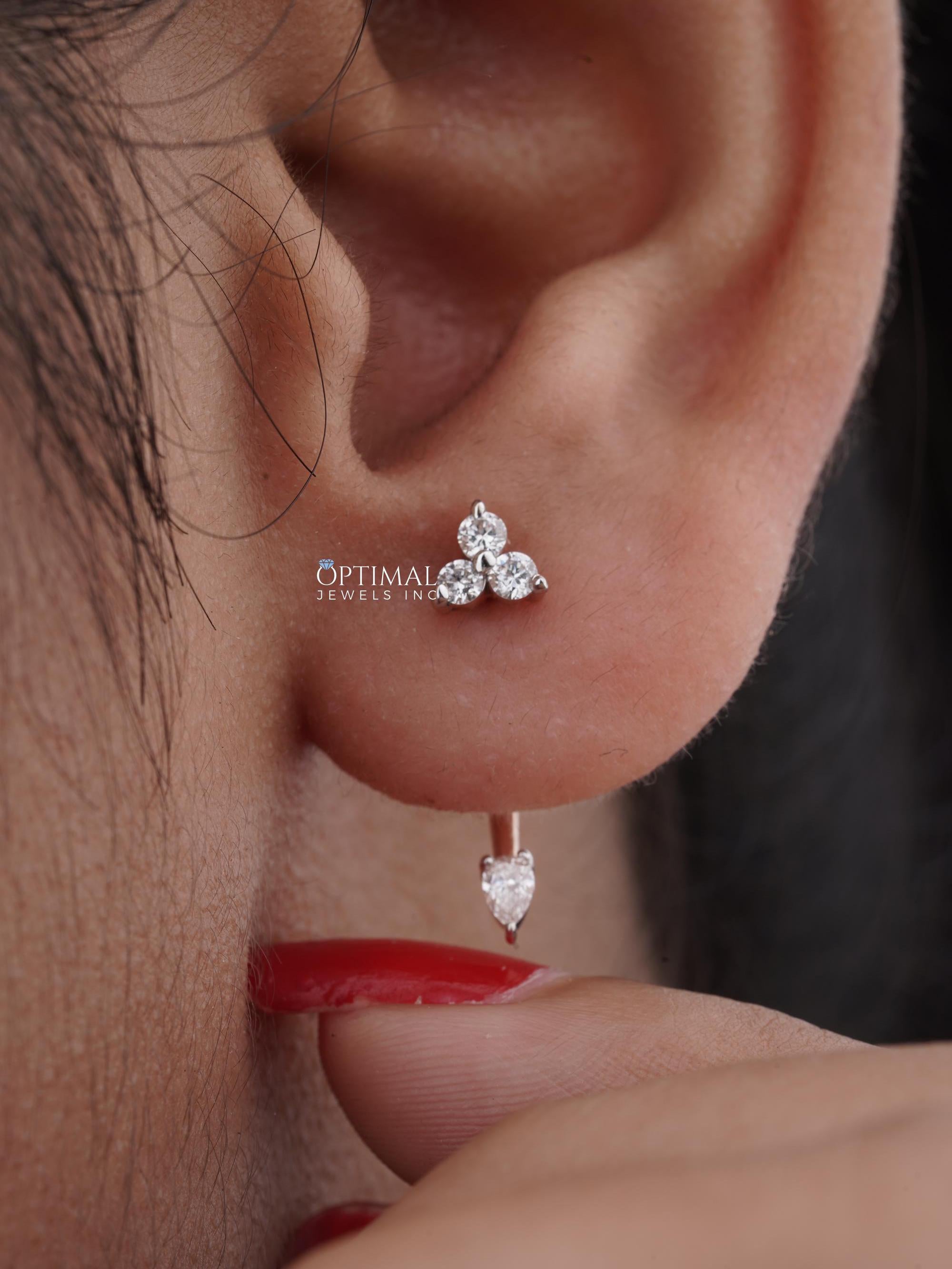 0.50 CTW Unique Rose Gold Earring featuring lab-grown diamonds in asymmetric design with round and pear-cut stones.