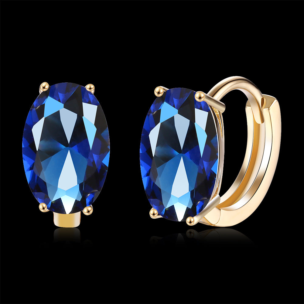 Elegant 1.00 Ct Sapphire Oval Cut Huggie Earring in 18K Gold Plated, showcasing a beautiful blue sapphire set in a gold-plated design.