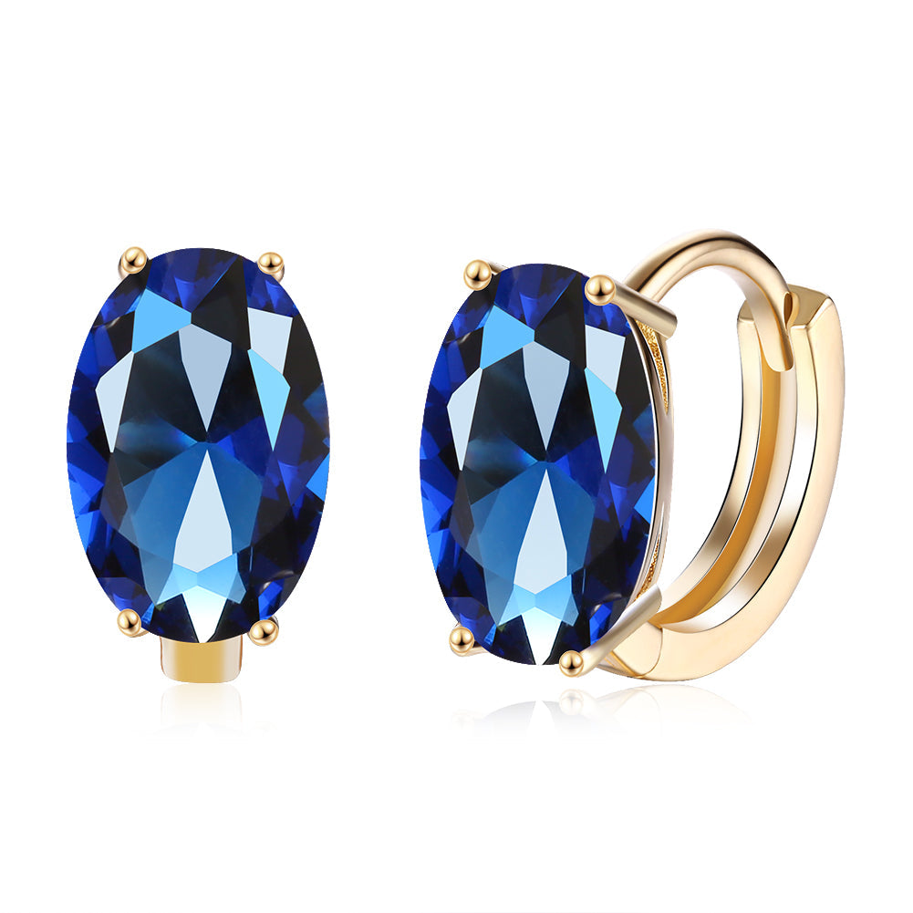 Elegant 1.00 Ct Sapphire Oval Cut Huggie Earring in 18K Gold Plated, showcasing a beautiful blue sapphire set in a gold-plated design.