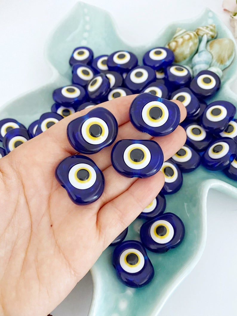 A collection of 10 blue resin evil eye charms, each 30mm in size, featuring a 6mm hole, perfect for wedding favors and party gifts.
