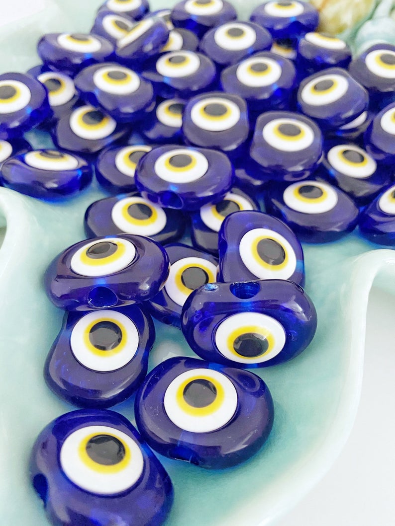 A collection of 10 blue resin evil eye charms, each 30mm in size, featuring a 6mm hole, perfect for wedding favors and party gifts.