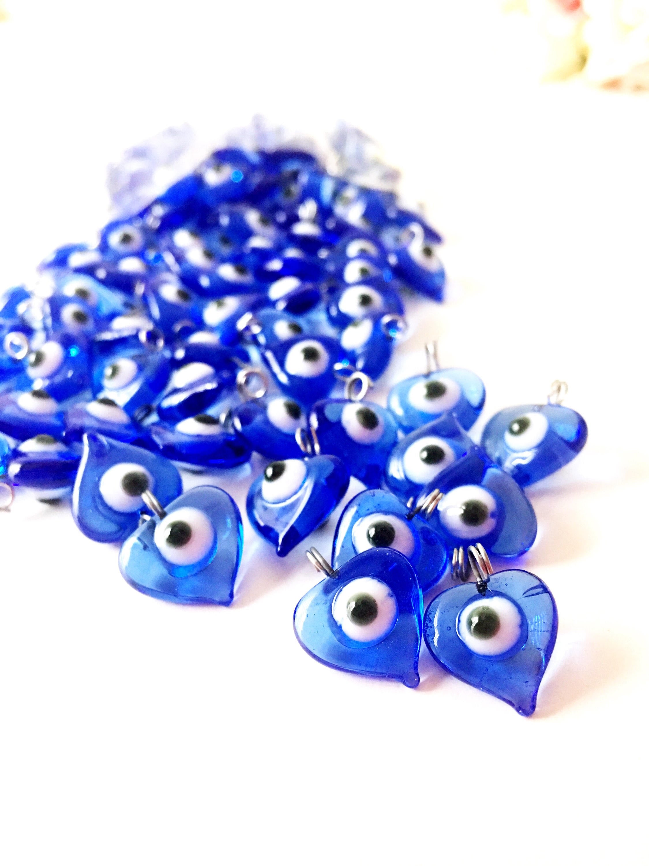 A collection of 10 blue glass evil eye charms with metal hooks, symbolizing protection and good luck, ideal for wedding favors and DIY jewelry.