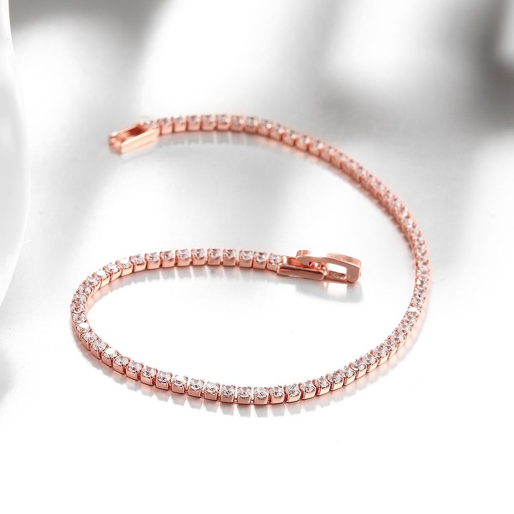 A luxurious 5-piece jewelry set featuring a tennis bracelet, halo earrings, and a necklace, all adorned with sparkling Austrian crystals and rose gold plating.