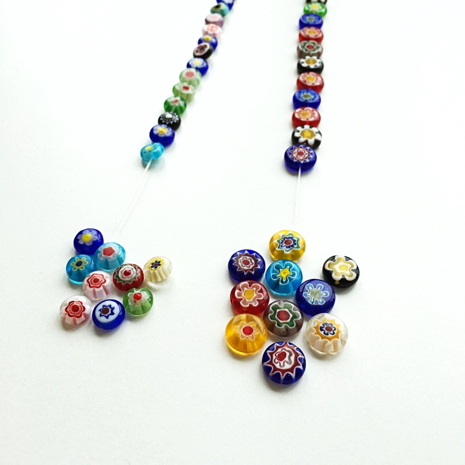 A vibrant assortment of 10mm and 8mm millefiori flat coin glass beads featuring floral designs in assorted colors, ideal for jewelry making.