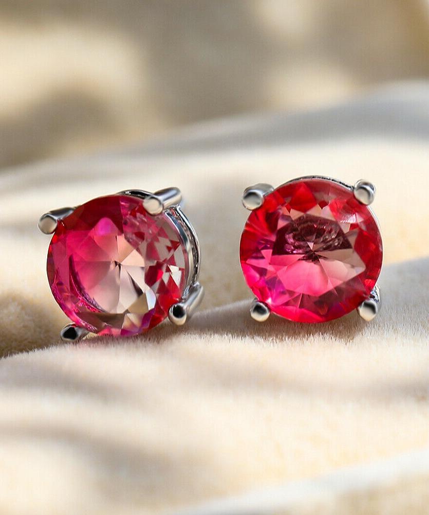 1.25ct round cut pink and yellow stud earrings with crystals, showcasing a bi-color design and elegant craftsmanship.