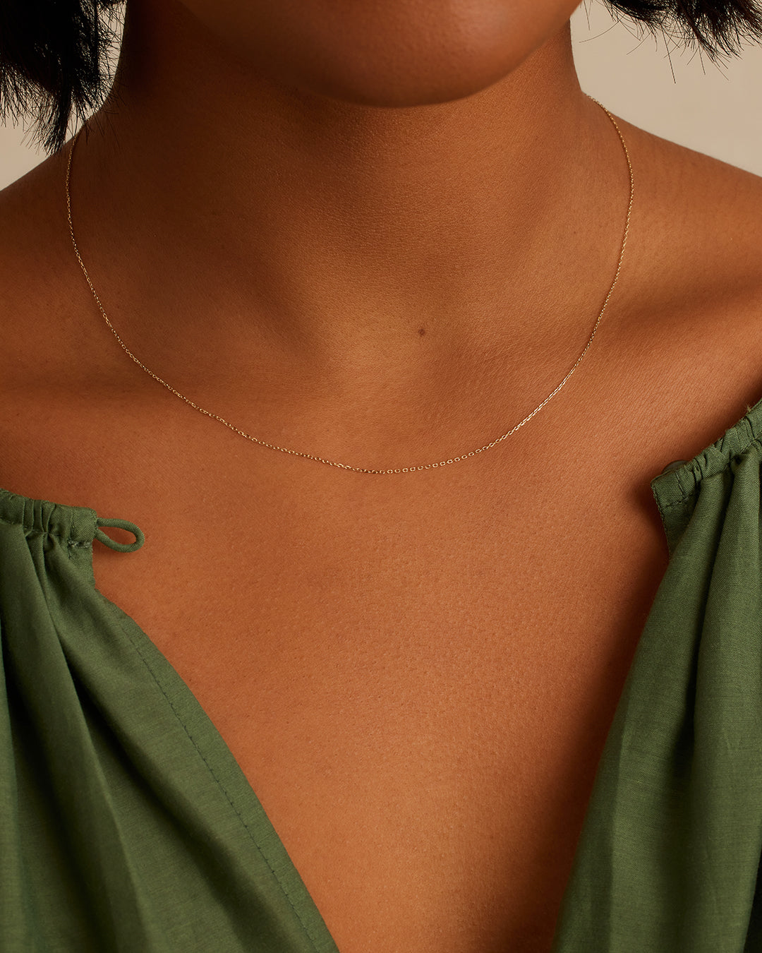 A stunning 14k gold basic chain, showcasing its elegant design and rich color, perfect for any outfit.