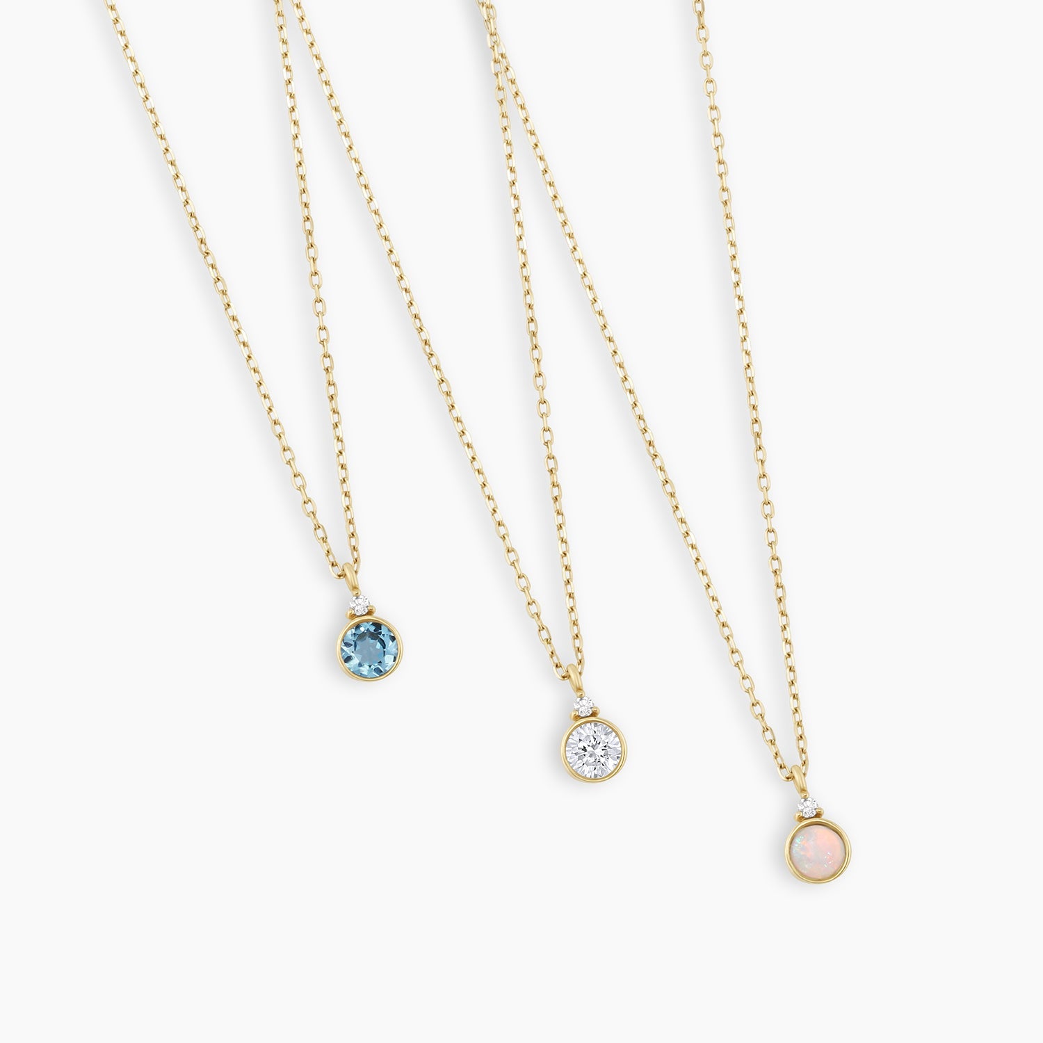 A beautiful 14k gold necklace featuring a personalized birthstone, elegantly designed for everyday wear.