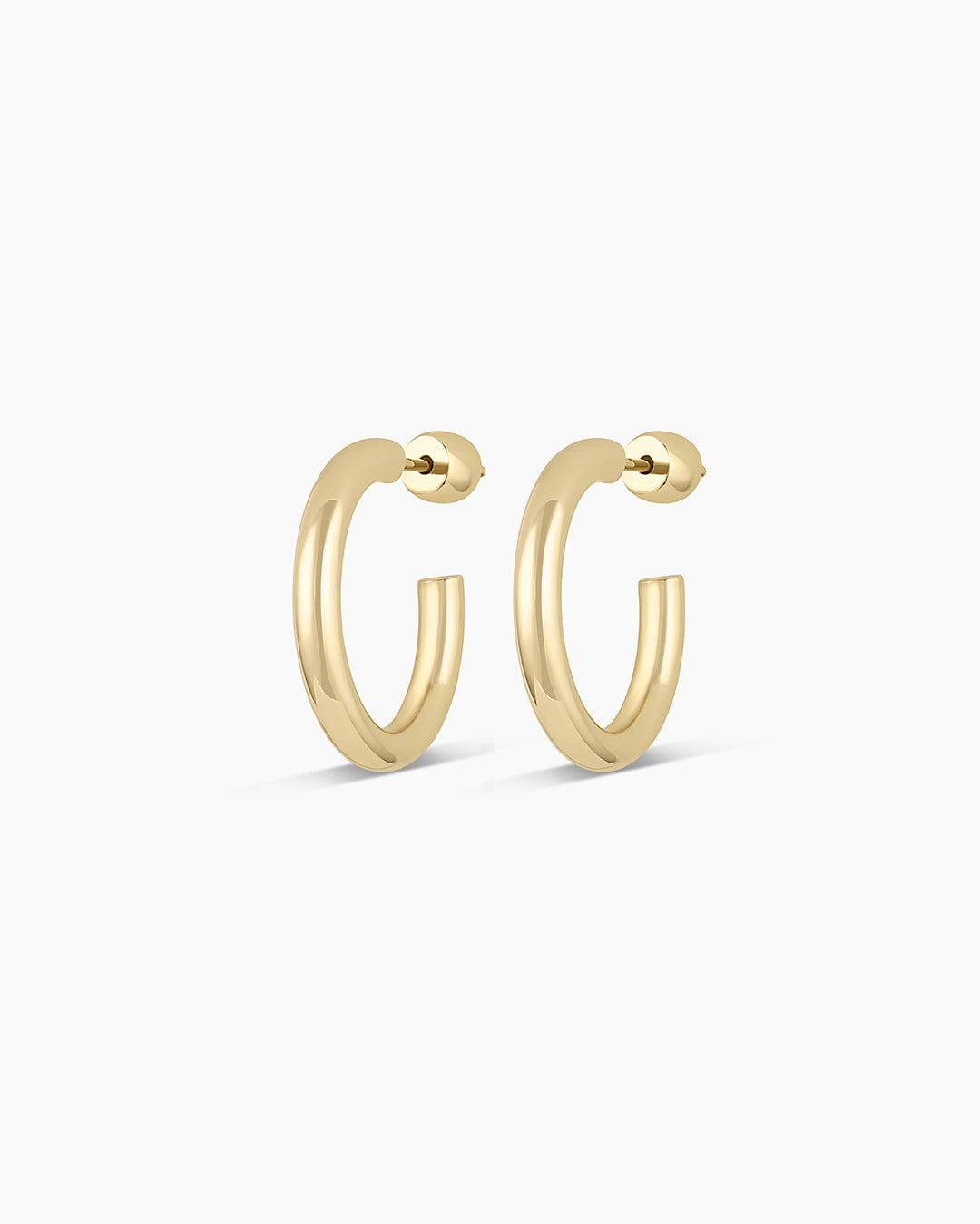 Elegant 14k Gold Carter Hoops showcasing a classic design, perfect for any outfit.