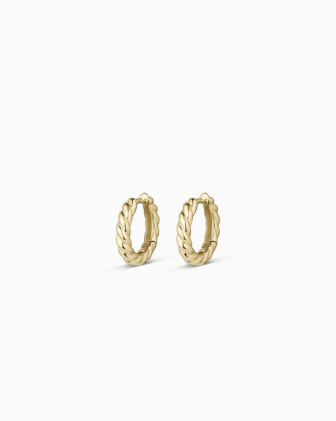 Elegant 14k Gold Crew Helium Huggies earrings, showcasing a lightweight and luxurious design perfect for everyday wear.