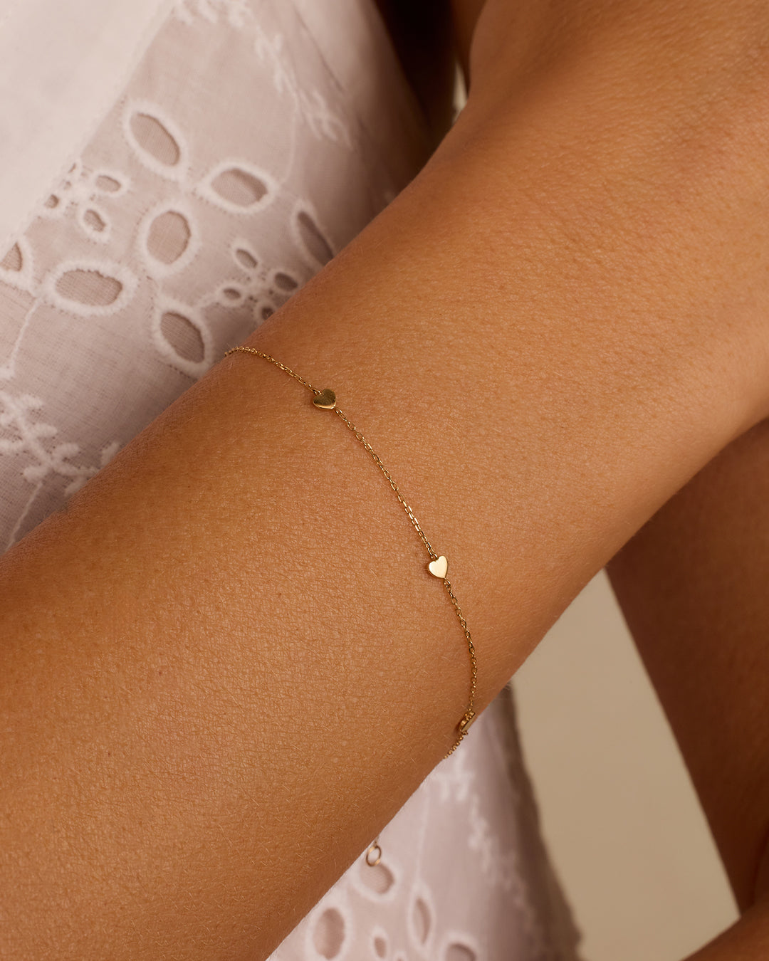 Elegant 14k Gold Heart Bracelet featuring a delicate heart design, perfect for any outfit.