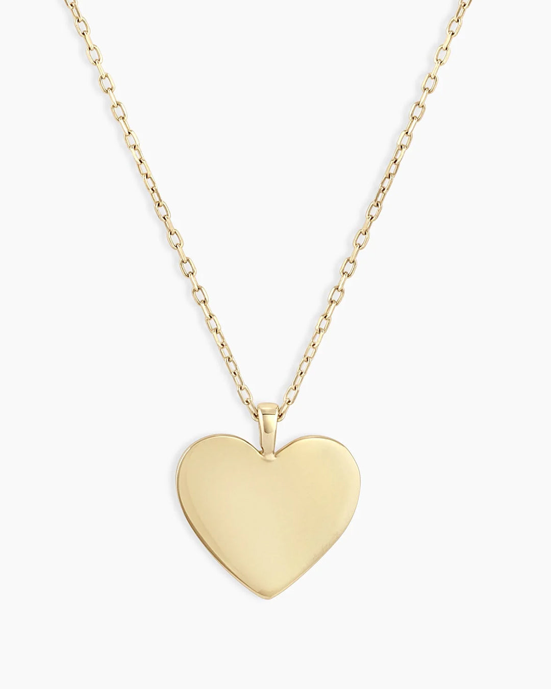 A beautiful 14k gold heart necklace showcasing its delicate design and luxurious shine.