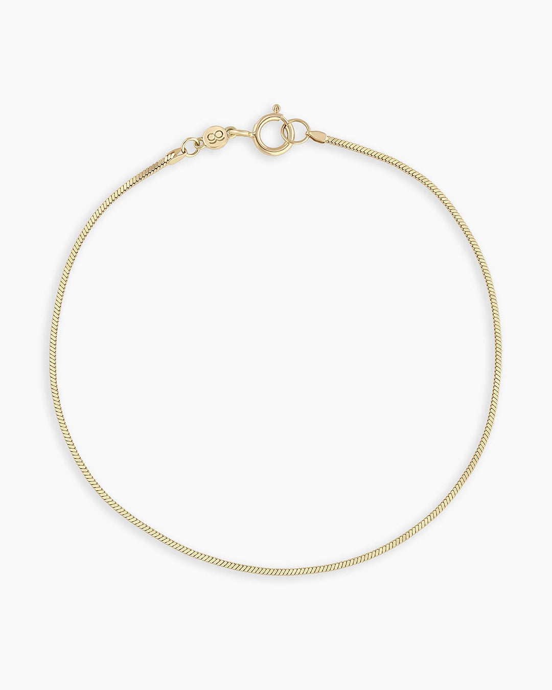 A delicate 14k gold micro mini Venice bracelet showcasing intricate craftsmanship and a luxurious finish.