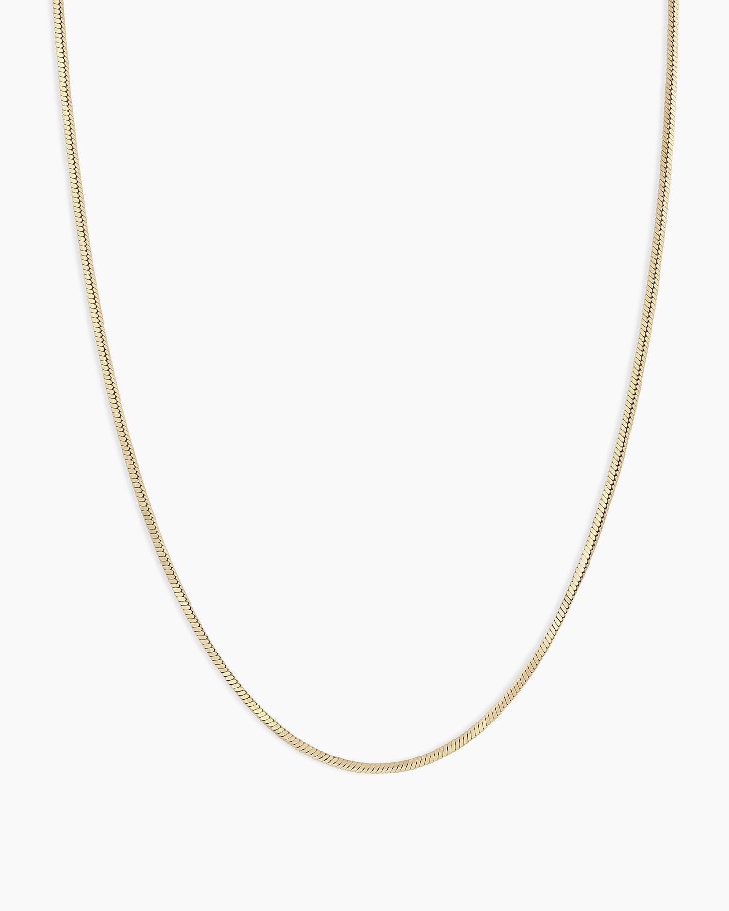 A delicate 14k gold Micro Mini Venice Necklace featuring intricate design, perfect for layering or standalone wear.