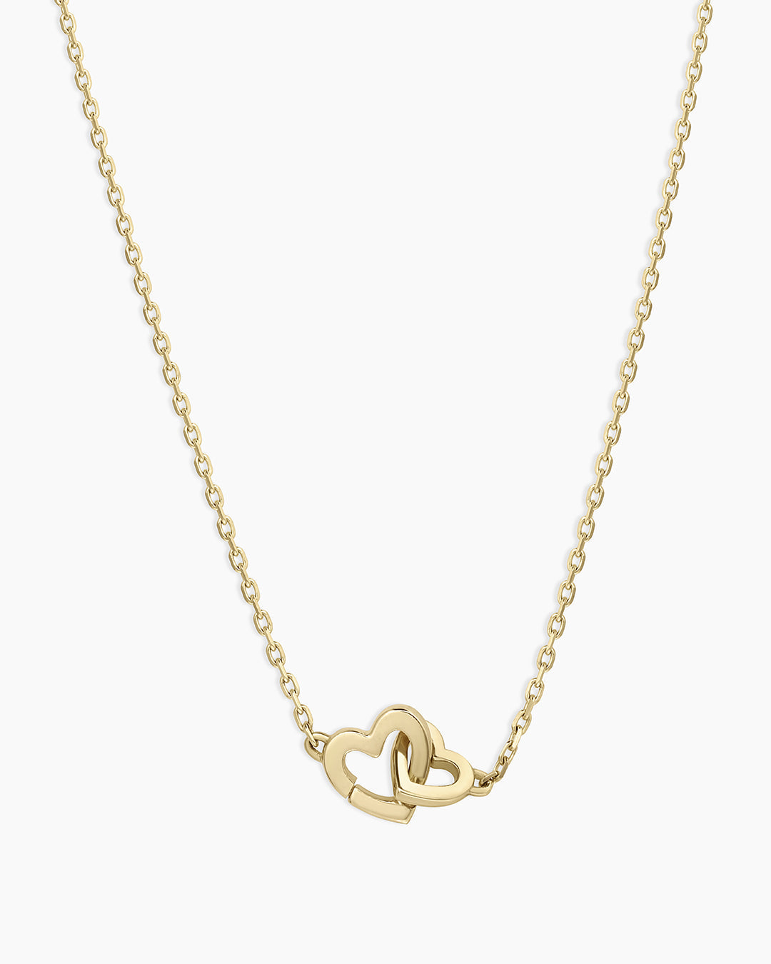 A beautiful 14k gold necklace featuring a unique heart design, perfect for adventurous spirits.