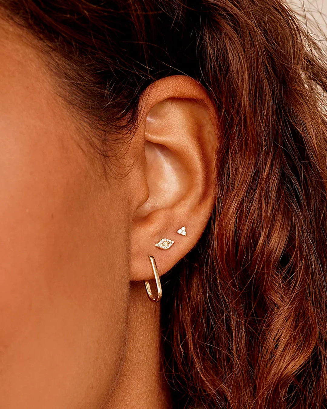 Elegant 14k Gold Parker Link Huggies earrings showcasing a unique link design, perfect for stylish outfits.