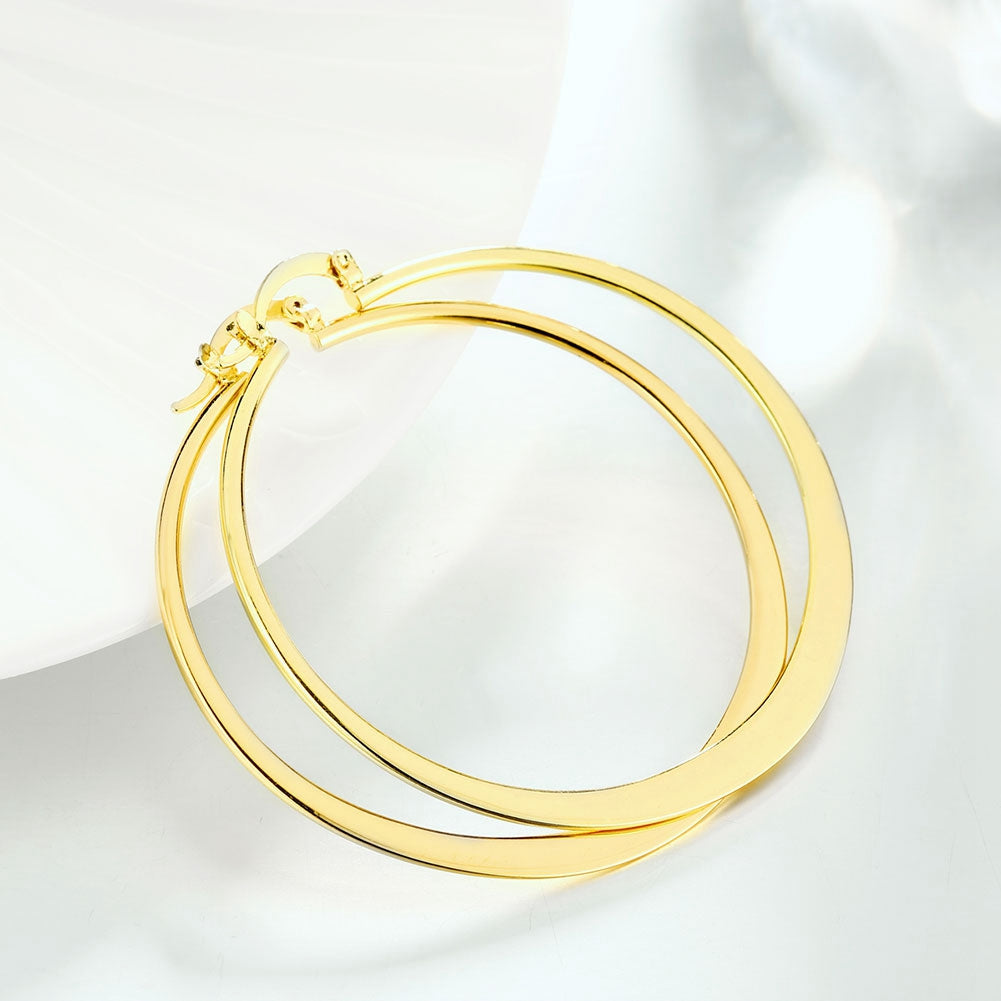 14K Gold Plated Sleek Classic Test Tube Hoop Earrings displayed elegantly, showcasing their unique design and shiny finish.