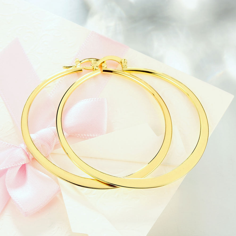 14K Gold Plated Sleek Classic Test Tube Hoop Earrings displayed elegantly, showcasing their unique design and shiny finish.