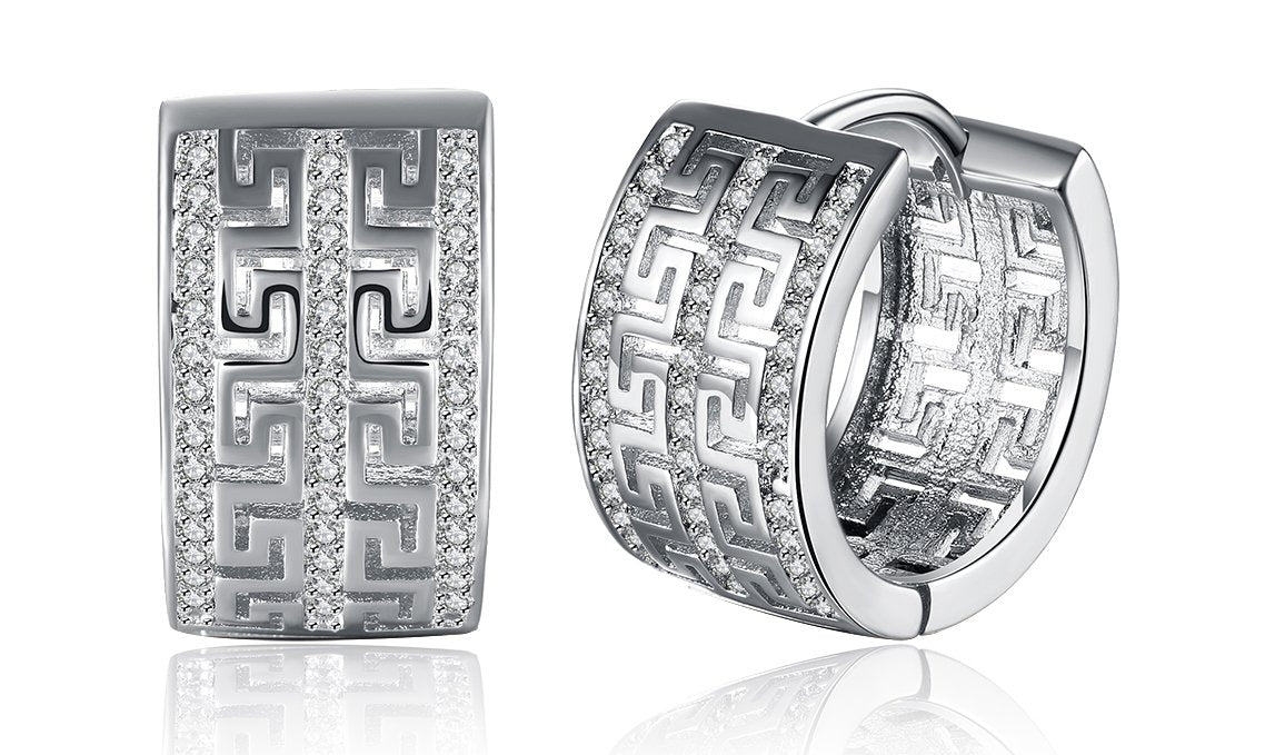 Elegant 14K gold plated hinge earrings featuring intricate laser cut Celtic design with white Austrian elements.