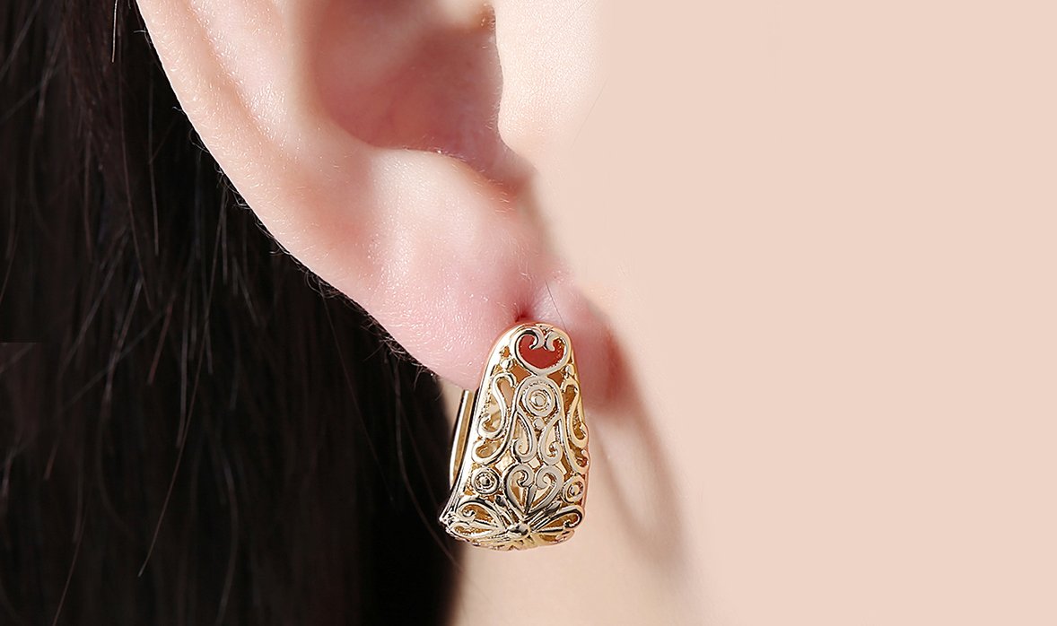 Elegant 14K gold plated filigree laser cut clip-on earrings designed in Italy, showcasing intricate patterns and a luxurious finish.