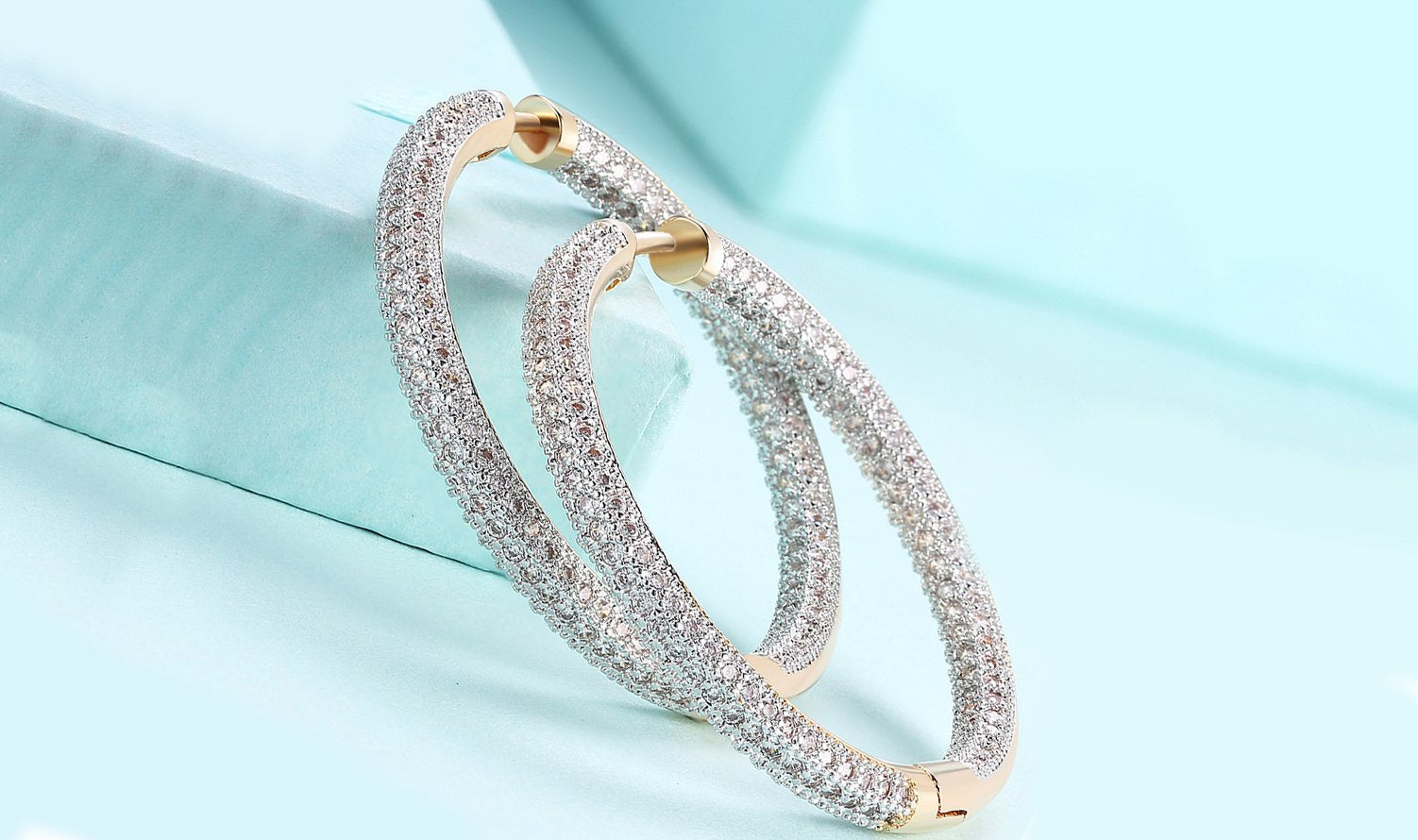 Elegant 14K Gold Plating Circular Hoop Earrings with pav'e detailing, inspired by London fashion, available in gold and white gold.