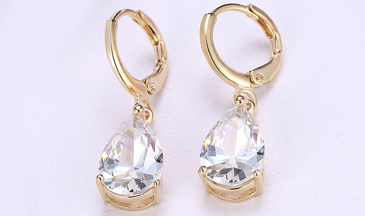 Elegant 14K gold plated pear cut drop earrings in blue, purple, and white options, showcasing their sleek design and high-quality craftsmanship.