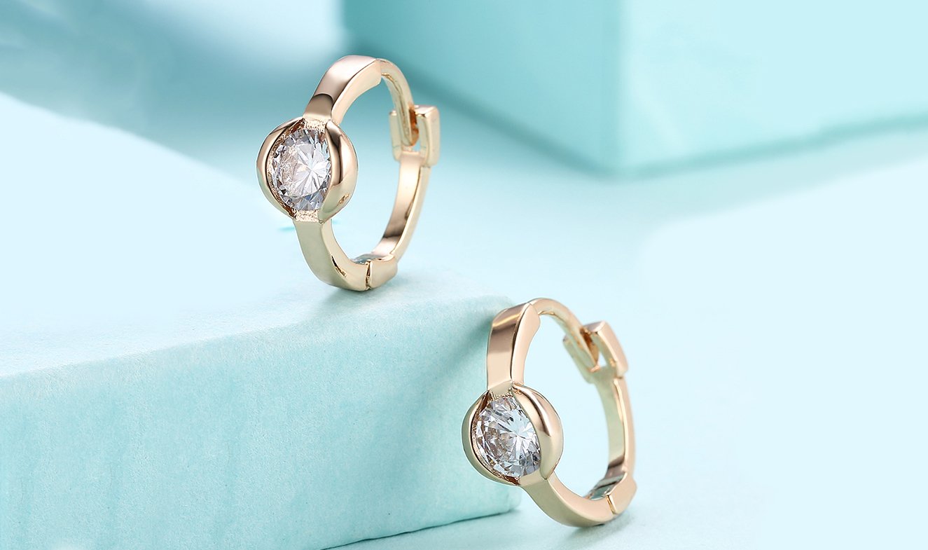 Elegant 14K gold plated circular clip-on earrings featuring white Austrian elements, designed in Italy for a luxurious look.