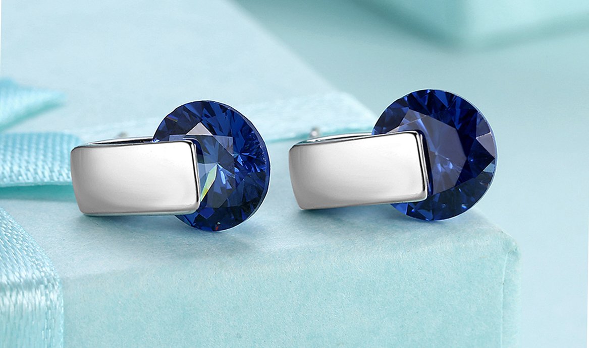 Elegant 14K white gold plated earrings featuring blue Austrian elements, designed as stylish stud earrings.