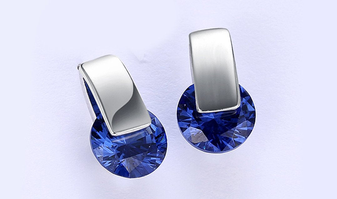 Elegant 14K white gold plated earrings featuring blue Austrian elements, designed as stylish stud earrings.
