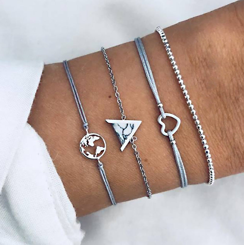 14K white gold plated bracelet set featuring a triangular white marble pendant, elegant link chain, and lobster clasp.