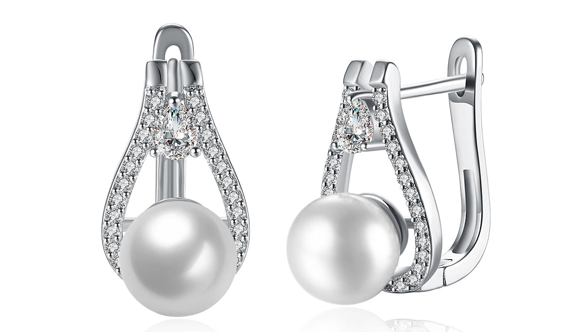 Elegant 14K white gold plated clip-on earrings featuring white sapphire stones and freshwater pearls in a pear cut design.