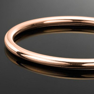 18ct Heavy Rose Gold Plated Classic 5mm Wide Solid Golf Bangle displayed elegantly, showcasing its luxurious finish and craftsmanship.