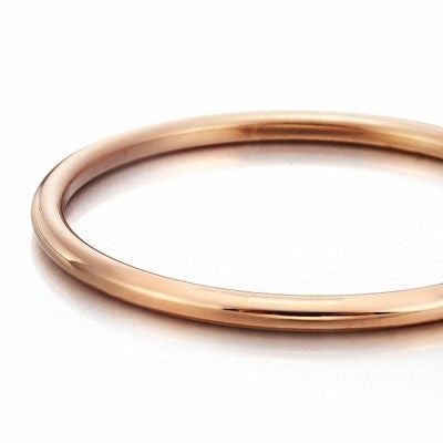 18ct Heavy Rose Gold Plated Classic Wide Solid Golf Bangle displayed elegantly, showcasing its shiny finish and classic design.
