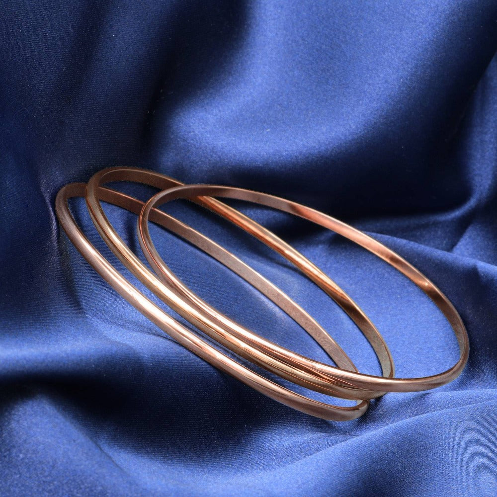 18ct Heavy Rose Gold Plated Plain 3mm Triple Bangle Set, showcasing three elegant bangles with a luxurious rose gold finish.