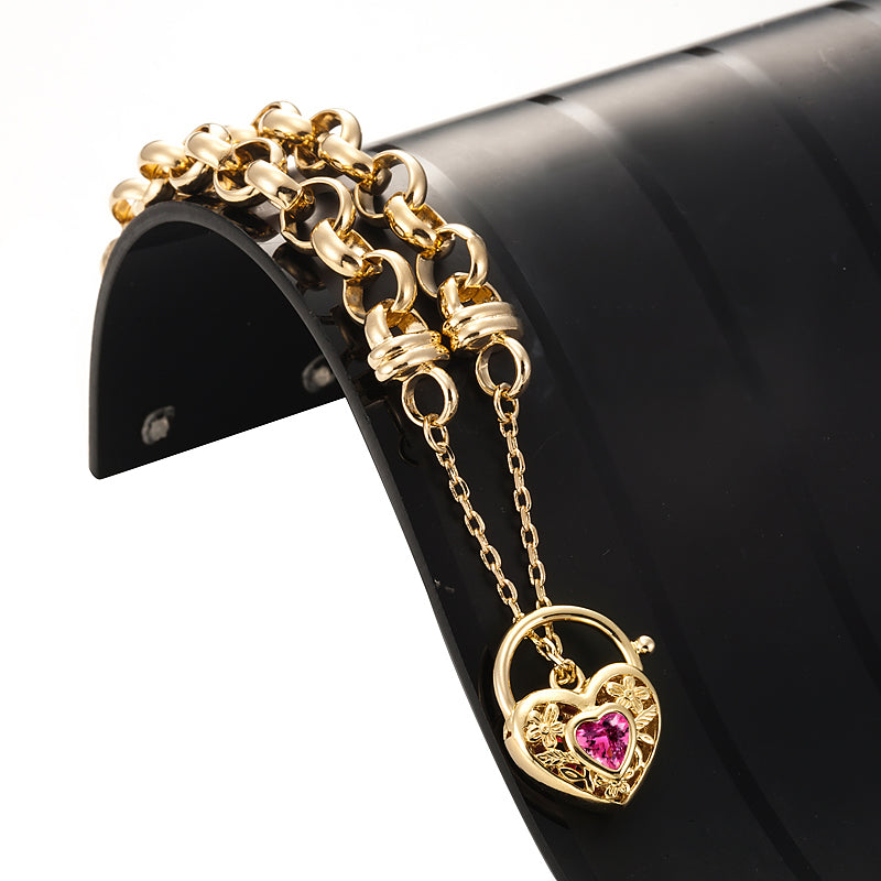 18ct Heavy Yellow Gold Plated 10mm Belcher Chain Bracelet featuring a pink filigree locket, showcasing its elegant design and craftsmanship.